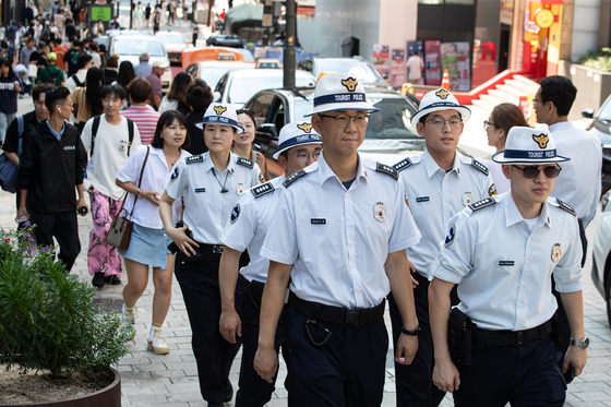 Korea Tourist Police officers patrol the streets of Myeongdong in central Seoul on Friday in preparation for the upcoming spike of Chinese tourists [NEWS1]