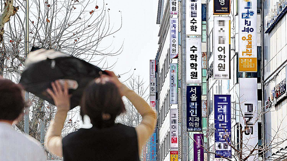Signboards of private cram schools fill the streets of Daechi-dong in Gangnam District, southern Seoul, on March 7. [YONHAP]