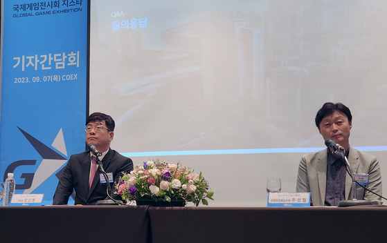 From left, G-star organizer Kang Shin-chul and Joo Sung-pil, the head of Busan IT Industry Promotion Agency, take questions at the press event for G-Star 2023 in Coex, southern Seoul, on Thursday. 