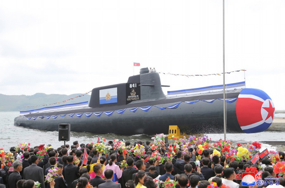 North Korea unveils a newly built ″tactical nuclear attack submarine” at a launching ceremony on Wednesday in a photo released by its official Korean Central News Agency on Friday. [YONHAP]