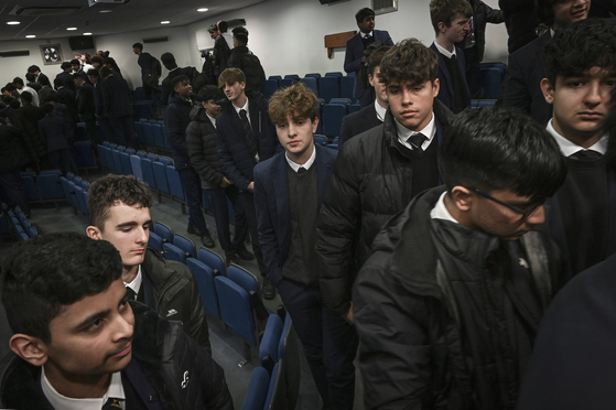 Students at The Merchant Taylors’ School, in the Northwood district of London, Jan. 18, 2023. More than 100 schools across England were ordered to close, on Thursday, Aug. 31, 2023, because they were built using unsafe concrete, the Department for Education said in a statement Thursday afternoon, a few days before the start of a new school year for most students. [Mary Turner/The New York Times]