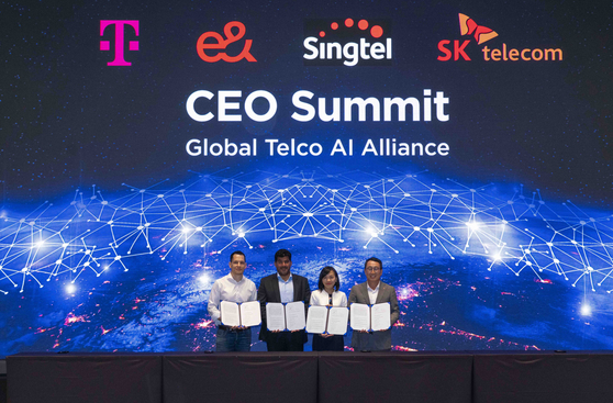 From left, Jonathan Abrahamson, head of product management for digital at Deutsche Telekom, Khalifa Al Shamsi, CEO of e& life, and Anna Yip, deputy CEO of Singtel, and SK Telecom’s CEO Ryu Young-sang pose for a photo at the Global Telco AI Alliance CEO Summit meeting on July 27 at the Grand Walkerhill Seoul hotel, eastern Seoul. [SKT]