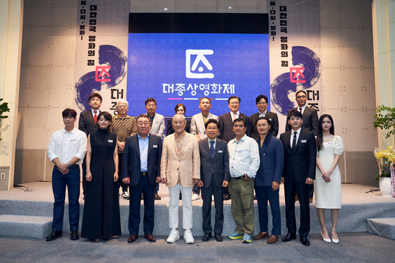 Organizers and ambassadors for this year's Daejong International Film Awards pose for a photo during a press conference for the awards at a hall in Konkuk University in Gwangjin District, eastern Seoul, on Tuesday. [DAEJONG INTERNATIONAL FILM AWARDS]