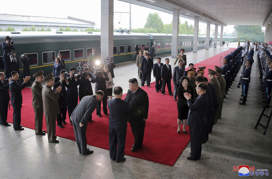 North Korean leader Kim Jong-un greets senior officials in Pyongyang before boarding a train to head to Russia Sunday afternoon in a photo released by the state-run Korean Central News Agency Tuesday. [YONHAP]