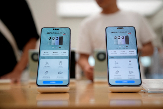 Pricing details of Huawei's Mate 60 Pro smartphones are seen on smartphones displayed at a Huawei store in Shanghai, China September 8, 2023. [REUTERS]