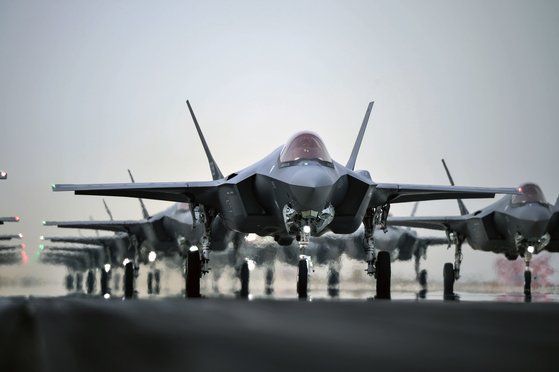 The F-35A Joint Strike Fighter stealth jets taxi on a runway during an “elephant walk” training at the 17th Fighter Wing in Cheongju, North Chungcheong, on March 25, 2022. [MINISTRY OF NATIONAL DEFENSE]