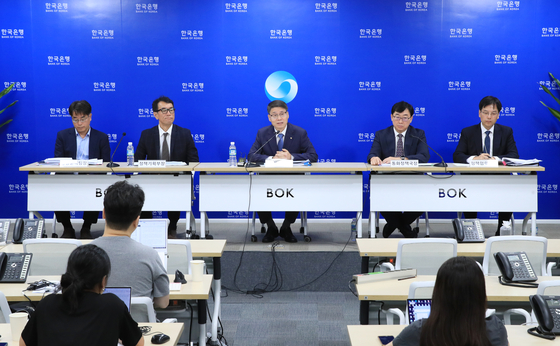 Lee Sang-hyeong, Deputy Governor at Bank of Korea, center, speaks at a press conference held at the central bank’s office in central Seoul on Thursday. [BOK]
