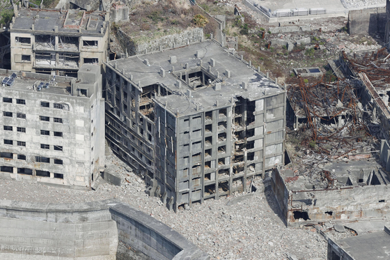 Decaying concrete structures on Hashima Island, one of the Unesco World Heritage sites connected with Japan’s Meiji Industrial Revolution enlisted in 2015. This file photo is dated Oct. 10, 2020. [YONHAP] 
