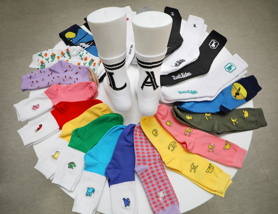 A collection of socks designed in collaboration with Korean character designers on display at the exhibit room of Seoul Socks Manufacturing Support Center on Sept. 7 [PARK SANG-MOON]