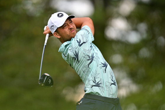 Xander Schauffele of the United States plays his shot from the fifth tee during the final round of the Tour Championship at East Lake Golf Club in Atlanta, Georgia on Aug. 27.  [GETTY IMAGES]