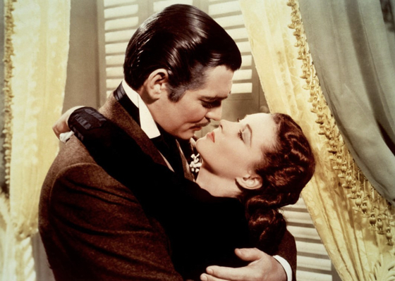 A scene from the film “Gone with the Wind.” Rhett Butler played by Clark Gable, left, and Scarlett O'Hara played by Vivien Leigh. [PETERPAN PICTURES] 