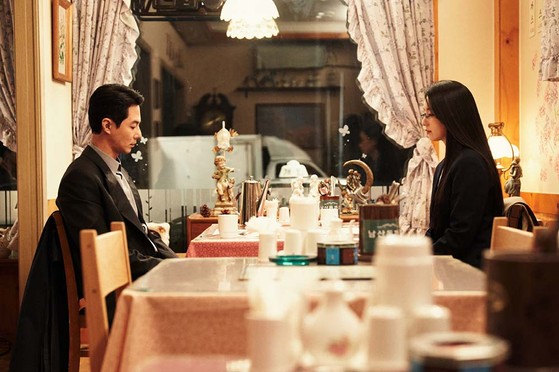 Han Hyo-joo's Mi-hyun, right, and Zo In-sung's Doo-sik, have their first date at a Namsan tonkatsu restaurant during a scene of "Moving." [DISNEY+]