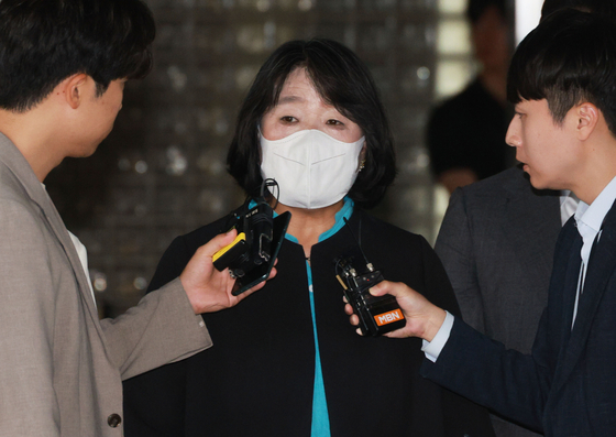 Lawmaker Yoon Mee-hyang responds to questions from the press in front of Seoul High Court in southern Seoul on Wednesday after the court convicted her of embezzling donations meant to support victims of the Japanese military's wartime sexual slavery. [YONHAP] 