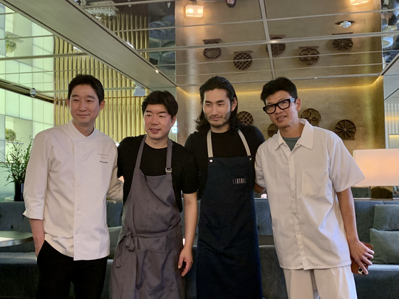 From left, chefs Kim Jeong-ho, Kim Ho-young, Jeong Sang and Yim Jung-sik collaborate for a nine-course menu at Jungsik Seoul in Gangnam District, southern Seoul. [LEE JIAN]