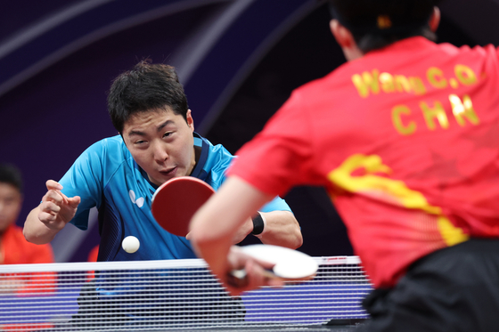 Korea's Lim Jong-hoon competes in the men’s table tennis team final against China at the Hangzhou Asian Games held at Gongshu Canal Sports Park Gymnasium in Hangzhou, China on Tuesday. [YONHAP]