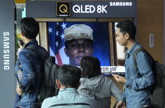 A TV screen shows a file image of American soldier Travis King during a news program at the Seoul Railway Station in Seoul, South Korea, Thursday, Sept. 28, 2023. The U.S. has secured the release of King who sprinted across a heavily fortified border into North Korea more than two months ago, and he is on his way back to America, officials announced Wednesday. U.S. ally Sweden and rival China helped with the transfer. [AP ] 