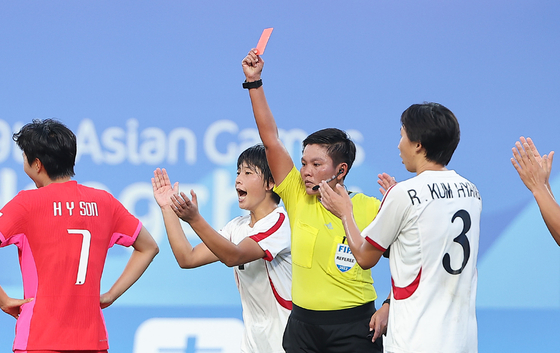 South Korea's Son Hwa-yeon is shown a red card during an Asian Games quarterfinal between South and North Korea in Hangzhou, China.  [YONHAP]