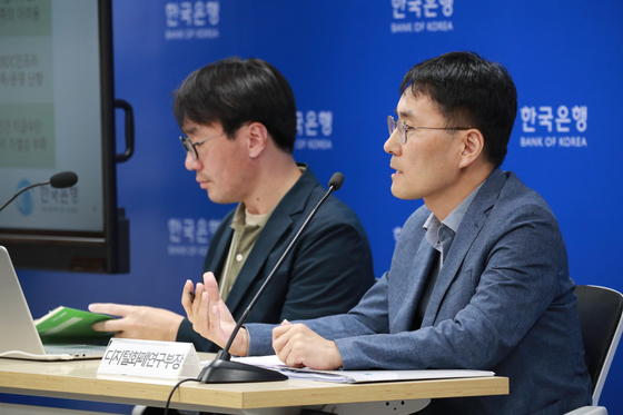 Bank of Korea officials speak in a press conference held to discuss central bank digital currency at the bank office in central Seoul on Thursday. [BOK]