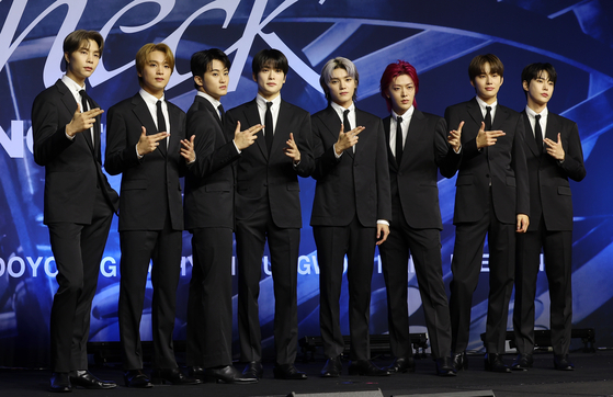 Members of boy band NCT 127 pose for photos during a press conference held on Friday at the Conrad Seoul hotel in western Seoul for its fifth full-length album ″Fact Check.″ [NEWS1]
