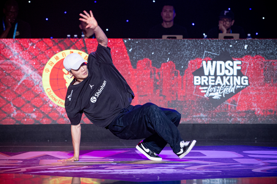 Korea's Kim Heon-woo, ″Wing,″ competes during the b-boy competition at the 2023 World DanceSport Federation (WDSF) Asian Breaking Championships in Hangzhou, China in July. [XINHUA]