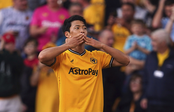 Wolverhampton Wanderers' Hwang Hee-chan celebrates scoring his side's first goal during a Premier League match against Aston Villa at Molineux in Wolverhampton, England on Sunday.  [AP/YONHAP]