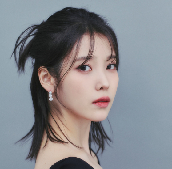 IU's agency will show 'no leniency' for those who spread rumors about singer
