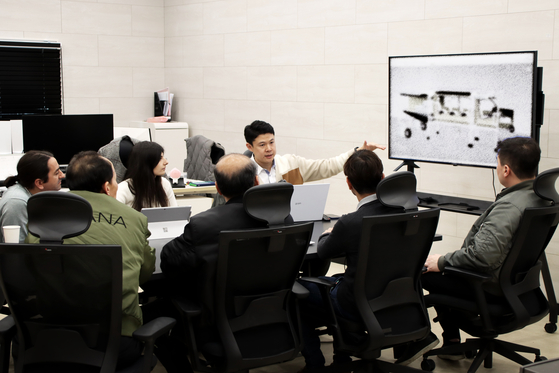 Plana employees in a meeting at the company's R&D center in Gyeonggi. Plana has 55 workers so far, of which 10 are foreigners. [PLANA]