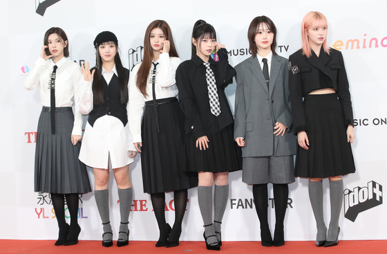 Girl group Nmixx poses for a photo at the red carpet event of the 2023 The Fact Music Awards, held at the Namdong Gymnasium in Incheon on Tuesday. [NEWS1]