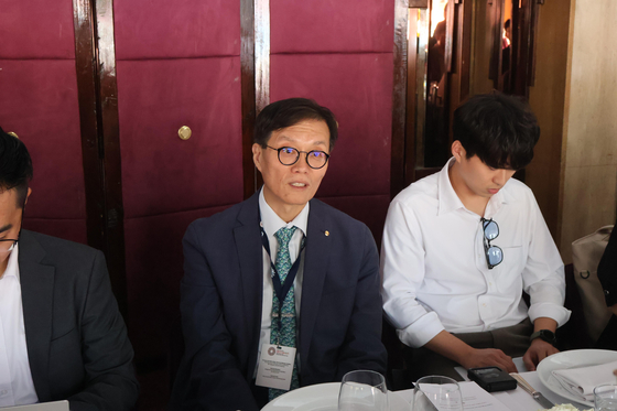 Bank of Korea Gov. Rhee Chang-yong, center, speaks during a meeting with reporters in Marrakesh, Morocco, on Oct. 11, 2023. [JOINT PRESS CORPS]