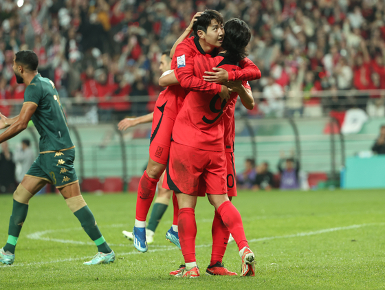 Lee Kang-in, left, celebrates with Cho Gue-sung after scoring his second goal for Korea during a friendly against Tunisia at Seoul World Cup Stadium in western Seoul on Friday.  [YONHAP]