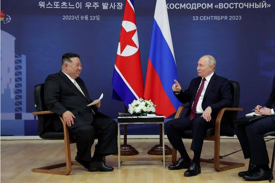 In this footage released by Pyongyang's state-controlled Korean Central Television, North Korean leader Kim Jong-un, left, talks with Russian President Vladimir Putin at the Vostochny Cosmodrome spaceport in the Russian Far East on Sept. 13. [YONHAP]