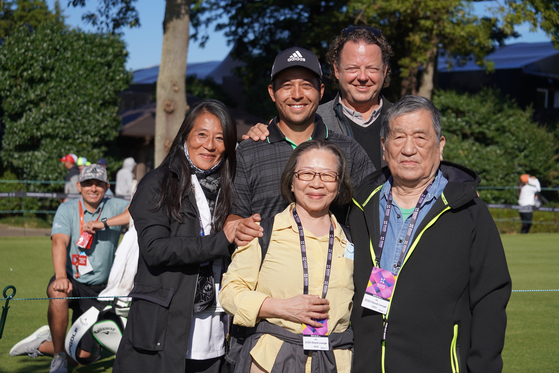Xander Schauffele with this parents and grandparents  [PGA TOUR]
