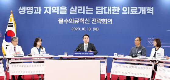 President Yoon Suk Yeol attends a strategic meeting on innovating the medical services held at Chungbuk National University in Cheongju, North Chungcheong, on Thursday. [PRESIDENTIAL OFFICE] 