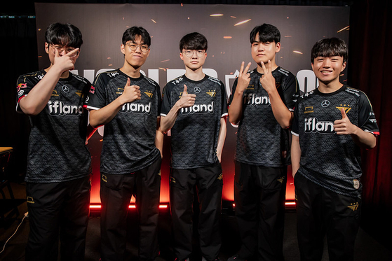 Five members of Korea's T1 pose during a media day ahead of the Swiss Stage opener at LoL Park in central Seoul on Tuesday. [RIOT GAMES]