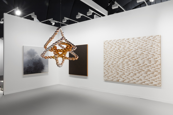 Jean-Michel Othoniel's installation piece ″Wild Knot″ on display at the Kukje Gallery booth in Paris+ par Art Basel art fair, along with paintings (from left) ″A Density of None - Grey″ by Kibong Rhee, ″Untitled 90-7-3″ (1990) by Chung Sang-hwa and ″From Point No. 770101″ (1977) by Lee Ufan [KUKJE GALLERY]