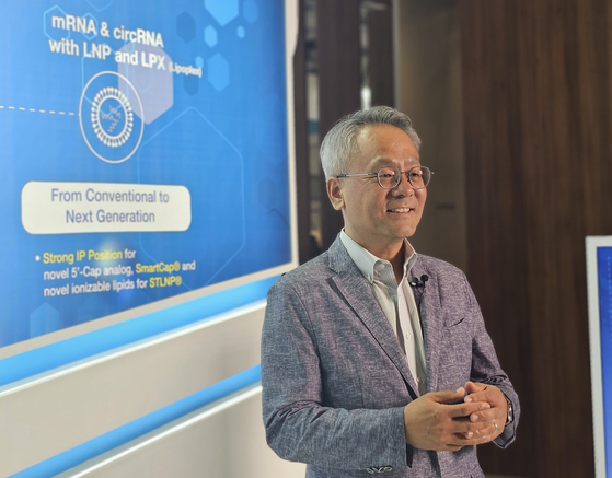 Kim Kyung-jin, CEO and president of ST Pharm, speaks at the company's booth during the CPHI Worldwide 2023 held in Barcelona on Tuesday. [SHIN HA-NEE]