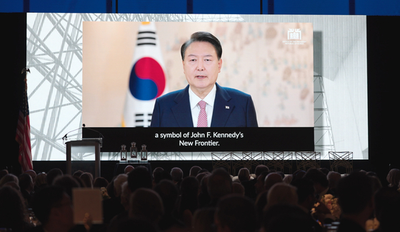 Korean President Yoon Suk Yeol gives an acceptance speech through a prerecorded video after being awarded the John F. Kennedy Library Foundation's Profile in Courage Award alongside Japanese Prime Minister Fumio Kishida in a ceremony at the Kennedy Library and Museum in Boston on Sunday. [PRESIDENTIAL OFFICE]