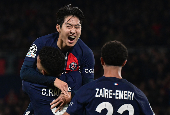 Paris Saint-Germain's Lee Kang-in celebrates scoring his team's third goal during the UEFA Champions League Group F football match against AC Milan at Parc de Princes in Paris in October. [AFP/YONHAP]
