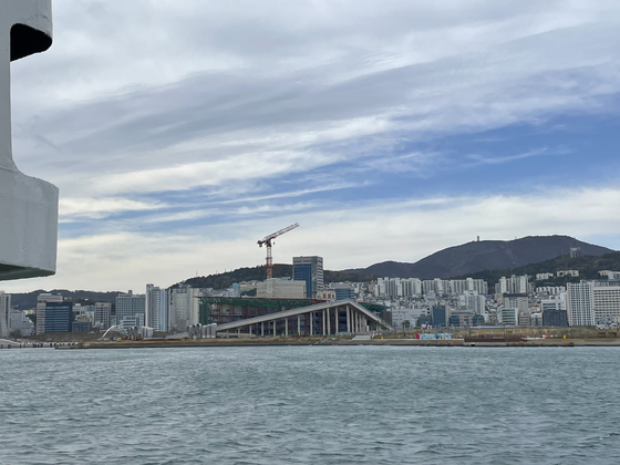 The opera house under construction seen from the distance in Busan’s North Port [LEE JAE-LIM]
