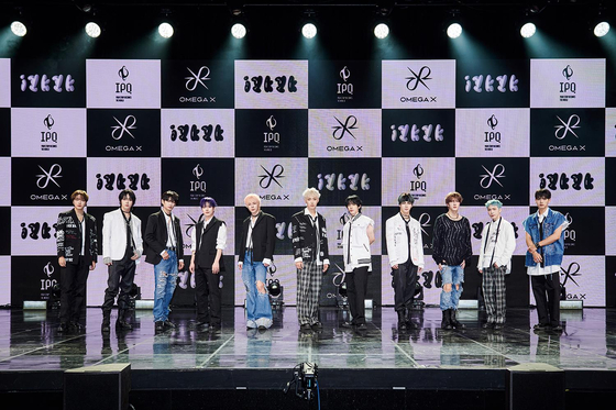 Boy band Omega X poses for photos during a showcase held at the Yes24 Live Hall in eastern Seoul for its third EP ″iykyk″ on Tuesday. [IPQ ENTERTAINMENT]