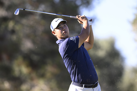 Tom Kim of Korea plays his shot from the 14th tee during the final round of the Shriners Children's Open at TPC Summerlin on Oct. 15 in Las Vegas. [GETTY IMAGES]