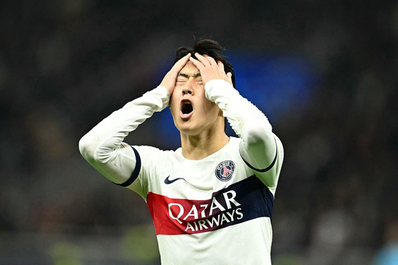 Paris Saint-Germain midfielder Lee Kang-in reacts during a UEFA Champions League Group F match against AC Milan at the San Siro stadium in Milan on Tuesday.  [AFP/YONHAP]