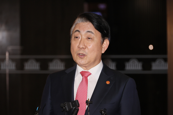 Lee Dong-kwan, chairman of the Korea Communications Commission (KCC), speaks to reporters after the Democratic Party (DP) filed a motion to impeach him at the National Assembly in western Seoul on Thursday. [YONHAP] 