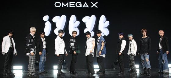 Boy band Omega X performs its new song ″Junk Food″ during a showcase held at the Yes24 Live Hall in eastern Seoul for its third EP ″iykyk″ on Tuesday. [NEWS1]