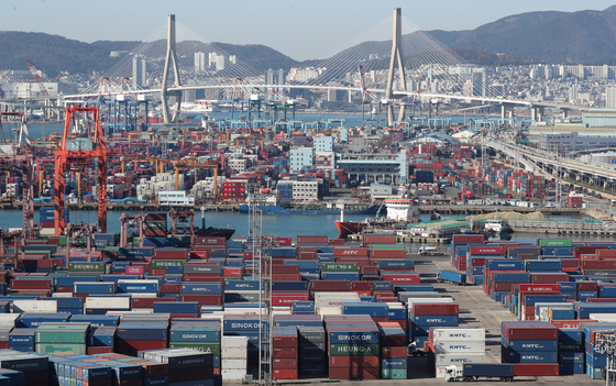 Shipping containers stacked at Busan Port are pictured on Monday. [NEWS1]