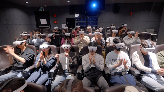 Audiences experience aespa's first virtual reality (VR) concert ″Lynk-pop: The 1st VR concert aespa″ at Megabox's COEX branch in southern Seoul [AMAZE VR]