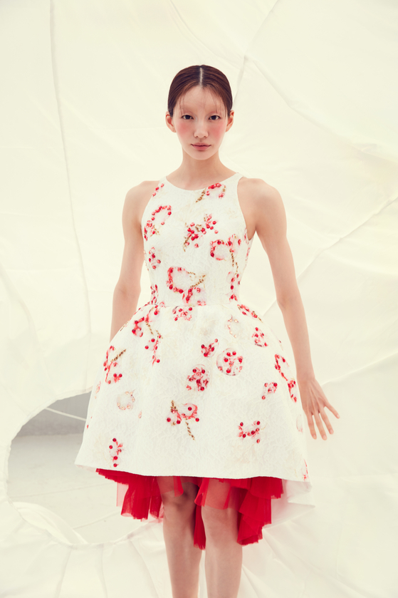 Fashion designer Chung Youn-min's white dress featuring Seung's paintings of pomegranates [CHUNG YOUN-MIN]