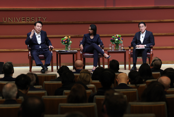Korean President Yoon Suk Yeol, left, speaks on a panel with Japanese Prime Minister Fumio Kishida, right, moderated by former U.S. Secretary of State Condoleezza Rice, center, at Stanford University's Hoover Institute in California on Friday. [JOINT PRESS CORPS]
