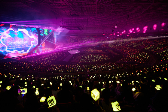 Fans flash lightsticks during the ″Neo City: Seoul - The Unity″ concert held at the KSPO Dome in southern Seoul on Sunday.