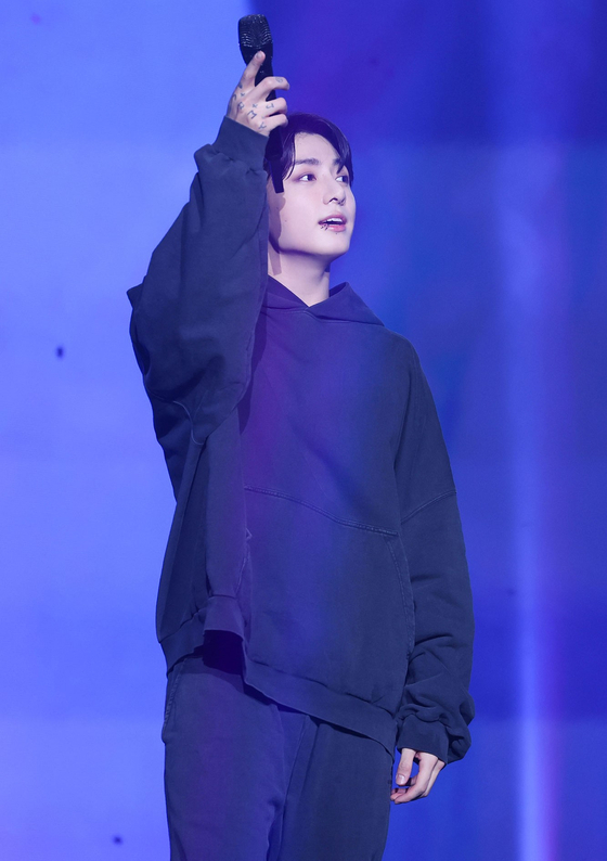 BTS' Jungkook performs at his, showcase ″Golden,″ on Monday at Jangchung Arena in Jung District, central Seoul [BIGHIT MUSIC]